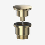 A brushed brass round clicker basin waste with a spring-loaded mushroom plug.